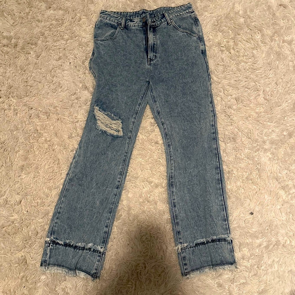 Never worn, middle waist wide legged denim jeans